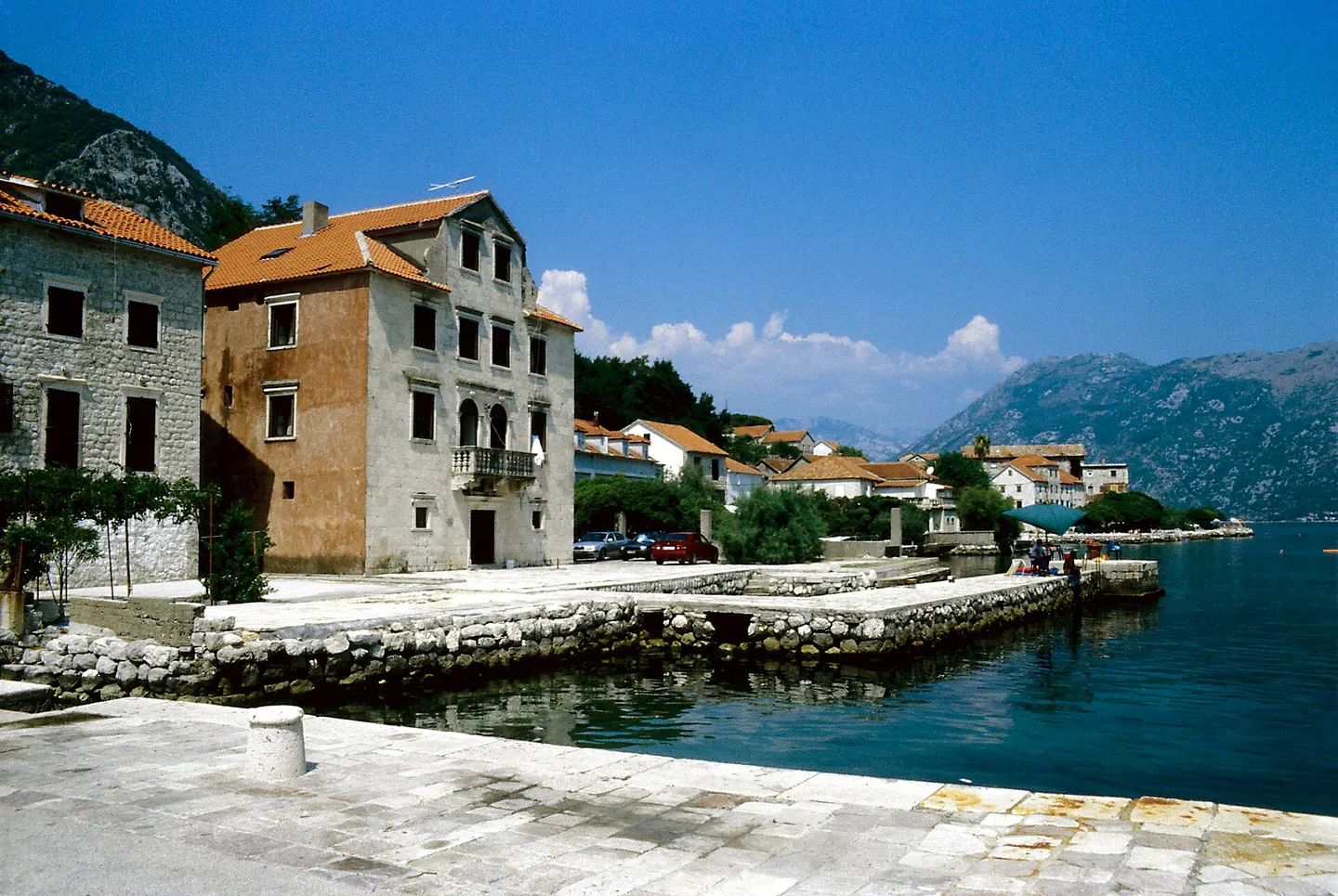 Stone waterfront and sheltered bay at Prčanj opposite Dobrota